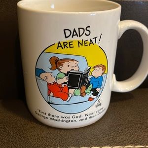 The Family Circus Dads are neat coffee mug. One small chip. Noted in picture.